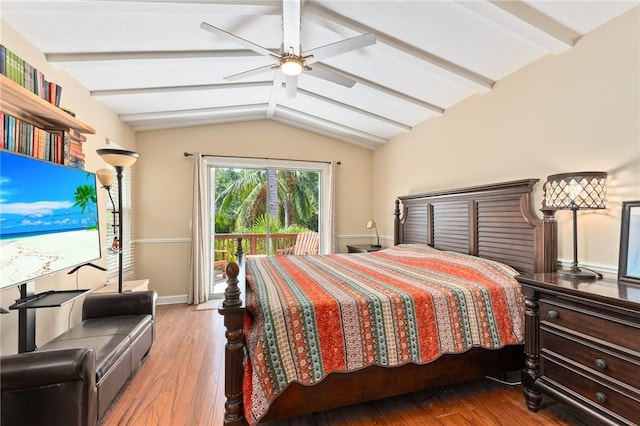 bedroom with ceiling fan, lofted ceiling with beams, and wood-type flooring