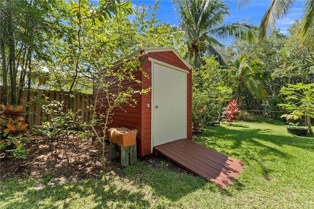 view of outdoor structure featuring a lawn