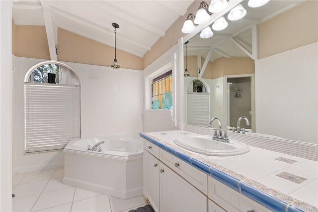 bathroom featuring tile patterned floors, vaulted ceiling with beams, vanity, and a washtub