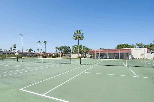 view of sport court with fence