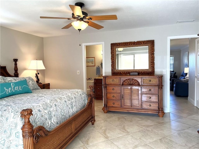 bedroom with ceiling fan, light tile patterned floors, and visible vents