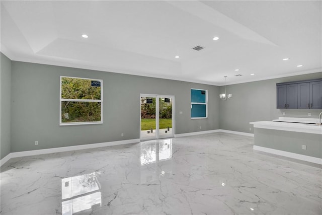 unfurnished living room featuring crown molding