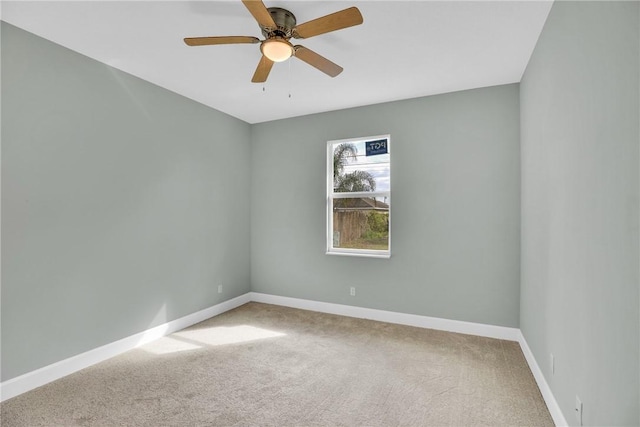 unfurnished room with ceiling fan and carpet floors