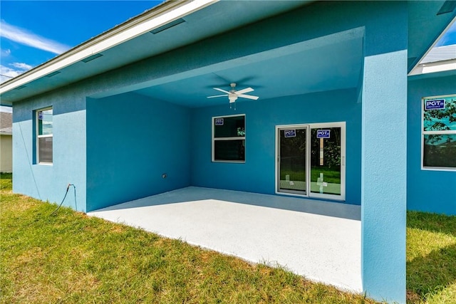 exterior space featuring ceiling fan