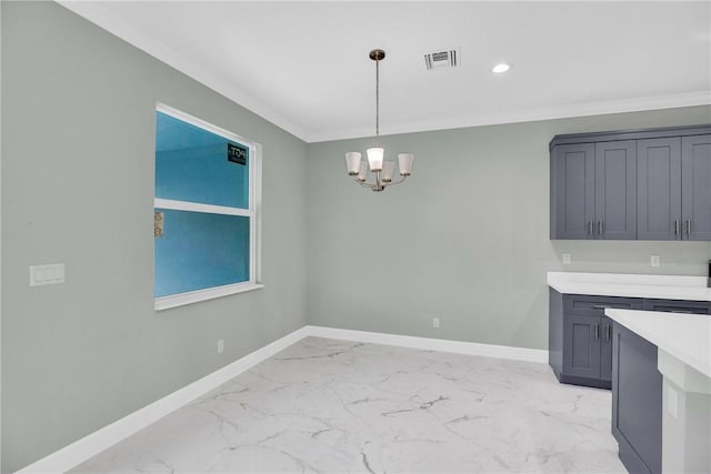 unfurnished dining area featuring a notable chandelier and ornamental molding