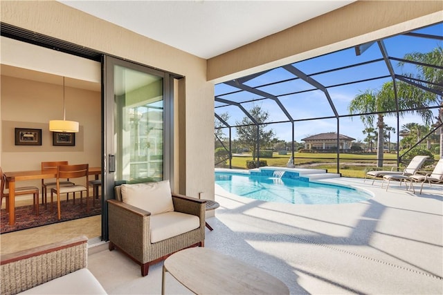 view of pool with a lanai and a patio