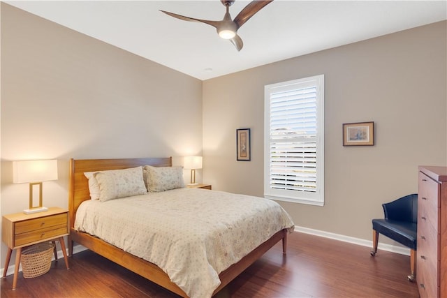 bedroom featuring ceiling fan and dark hardwood / wood-style flooring