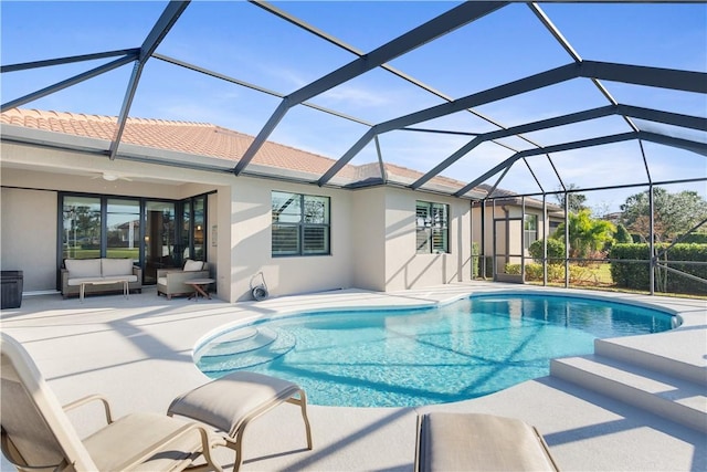 view of pool with a lanai and a patio