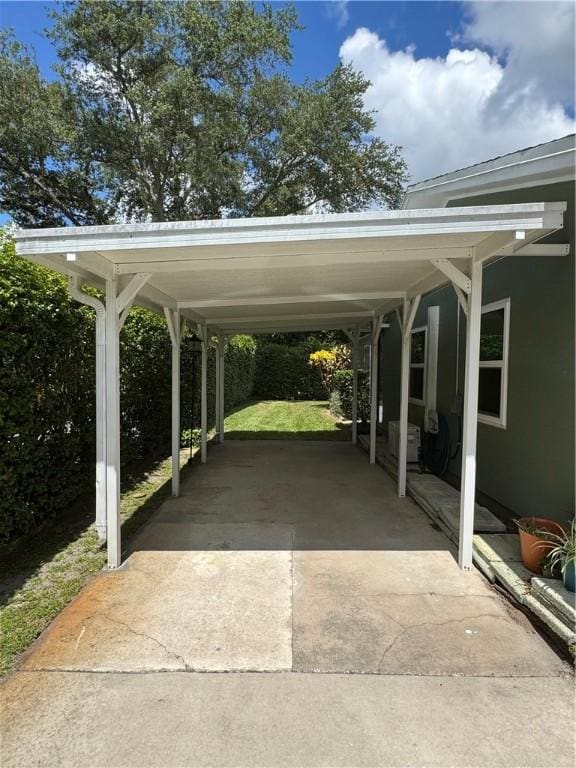 2525 84th Ter, Vero Beach, FL 32966 - view of parking / parking lot featuring driveway and a carport