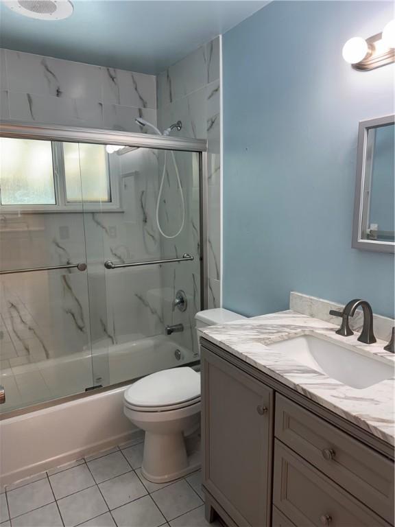 2525 84th Ter, Vero Beach, FL 32966 - bathroom with vanity, enclosed tub / shower combo, and tile patterned floors