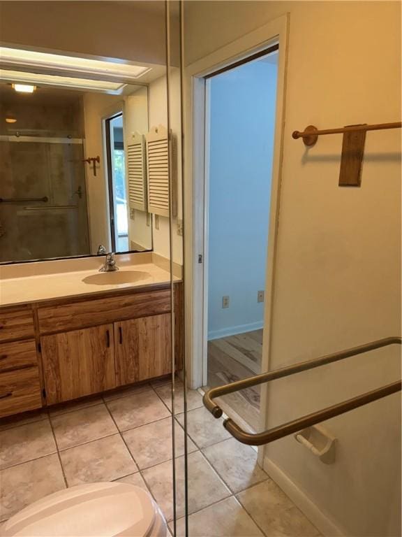 2525 84th Ter, Vero Beach, FL 32966 - full bath featuring vanity, tile patterned floors, and a shower with shower door