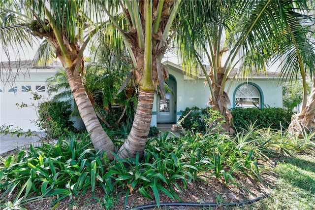 view of side of property with a garage