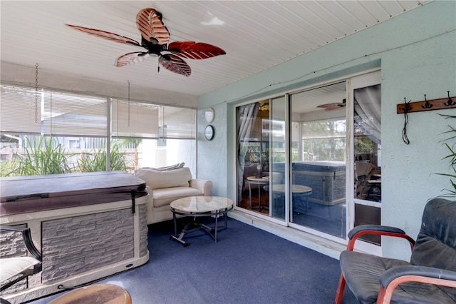 sunroom / solarium with plenty of natural light and ceiling fan