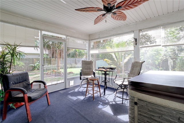 sunroom / solarium with ceiling fan