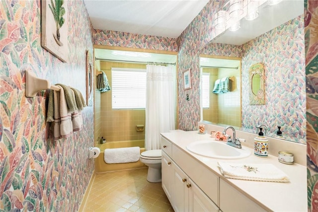 full bathroom featuring tile patterned floors, vanity, toilet, and shower / bath combo with shower curtain