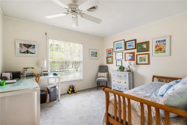 carpeted bedroom with ceiling fan and ornamental molding