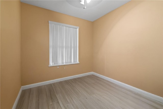 8365 104th Ct, Vero Beach, FL 32967 - empty room featuring a ceiling fan and wood finished floors