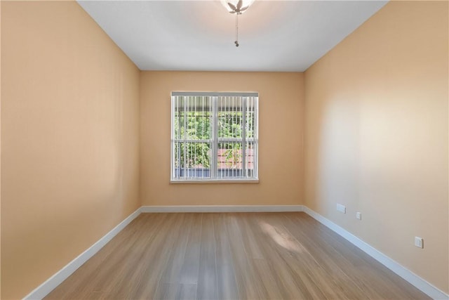 8365 104th Ct, Vero Beach, FL 32967 - unfurnished room with wood finished floors and baseboards