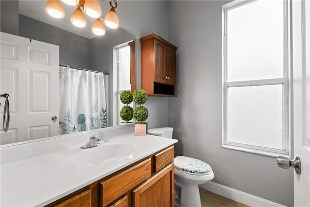 8365 104th Ct, Vero Beach, FL 32967 - full bathroom with vanity, a shower with curtain, and wood finished floors