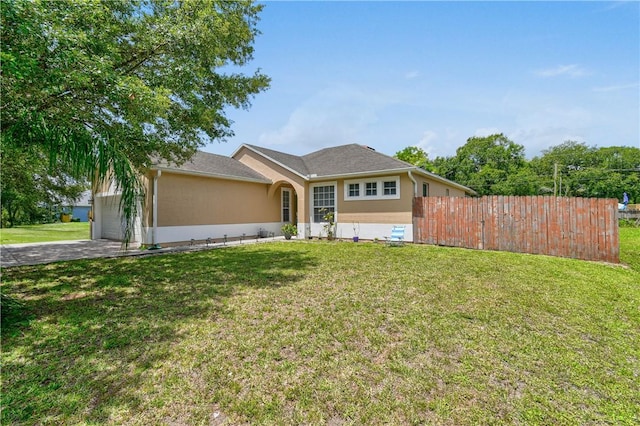 8365 104th Ct, Vero Beach, FL 32967 - ranch-style house with an attached garage, asphalt driveway, and stucco siding