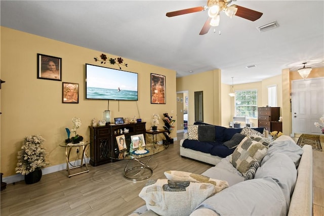 8365 104th Ct, Vero Beach, FL 32967 - living room featuring wood finished floors and a ceiling fan