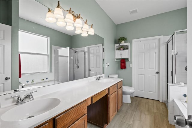 8365 104th Ct, Vero Beach, FL 32967 - bathroom featuring a stall shower, double vanity, and a bath