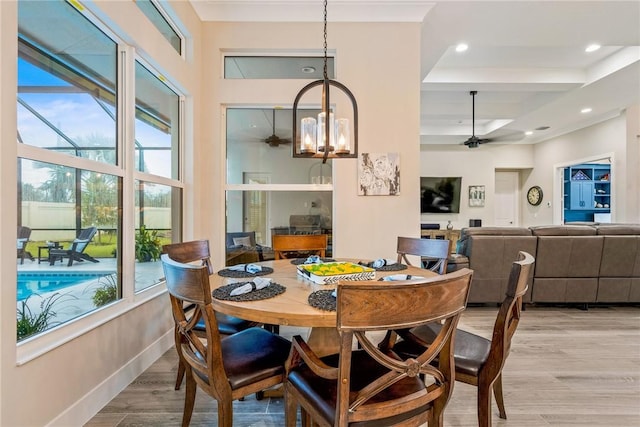 dining space with ceiling fan, plenty of natural light, light wood finished floors, and recessed lighting