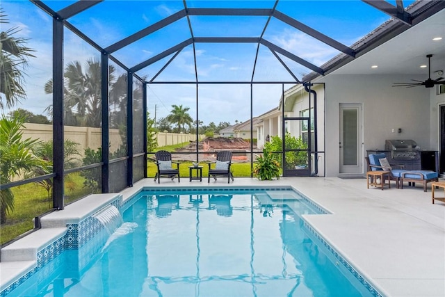 swimming pool with a patio, a ceiling fan, grilling area, and glass enclosure