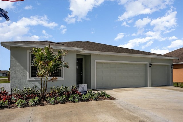 502 Saunders St, Sebastian, FL 32958 - view of front facade featuring stucco siding, a garage, and driveway
