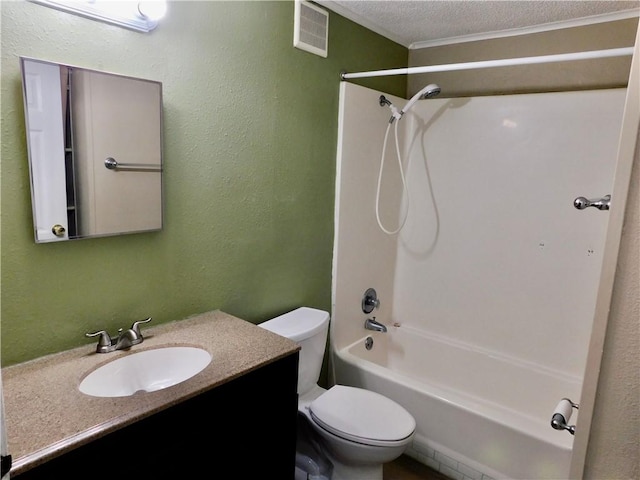 full bathroom with toilet, vanity, shower / washtub combination, a textured ceiling, and crown molding