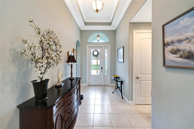 8280 Halbert Ln, Vero Beach, FL 32968 - entrance foyer with light tile patterned flooring, a raised ceiling, ornamental molding, baseboards, and washer / clothes dryer