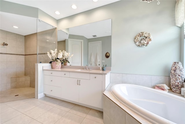 8280 Halbert Ln, Vero Beach, FL 32968 - bathroom featuring tile patterned flooring, a bath, walk in shower, vanity, and recessed lighting