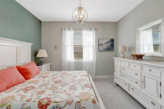 8280 Halbert Ln, Vero Beach, FL 32968 - bedroom featuring light colored carpet, a chandelier, and baseboards