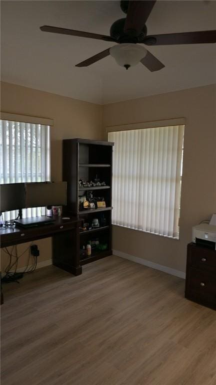 interior space with ceiling fan and hardwood / wood-style flooring