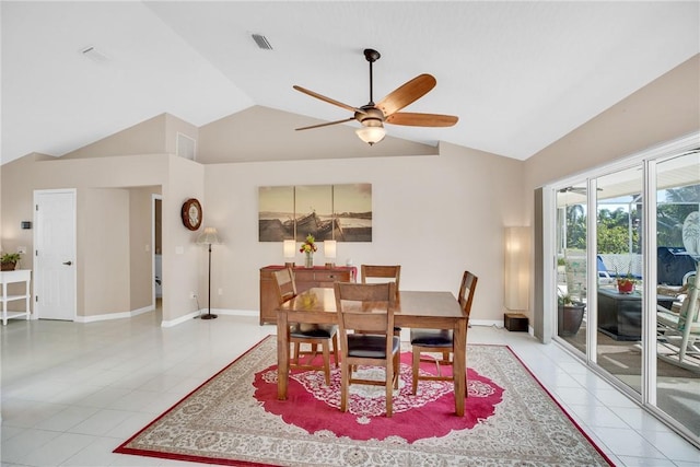 tiled dining area featuring ceiling fan and lofted ceiling