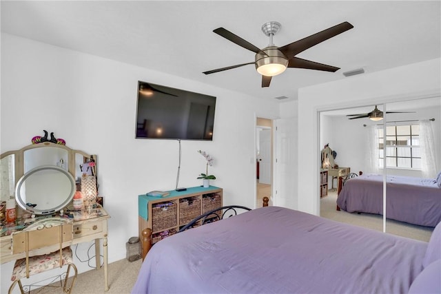 bedroom featuring ceiling fan and light colored carpet