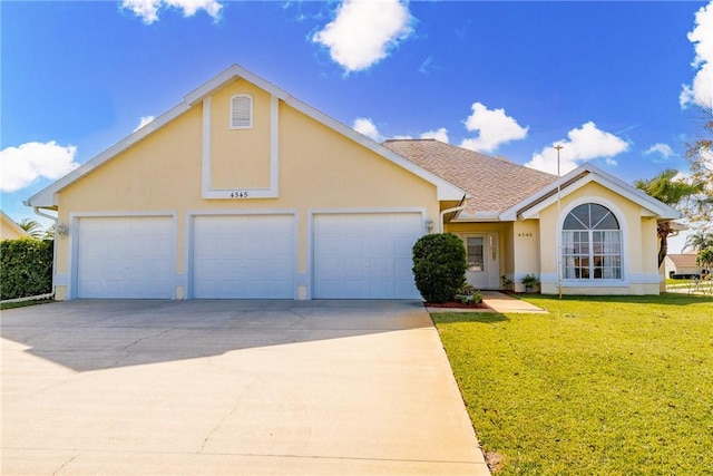 view of front of home featuring a garage and a front yard