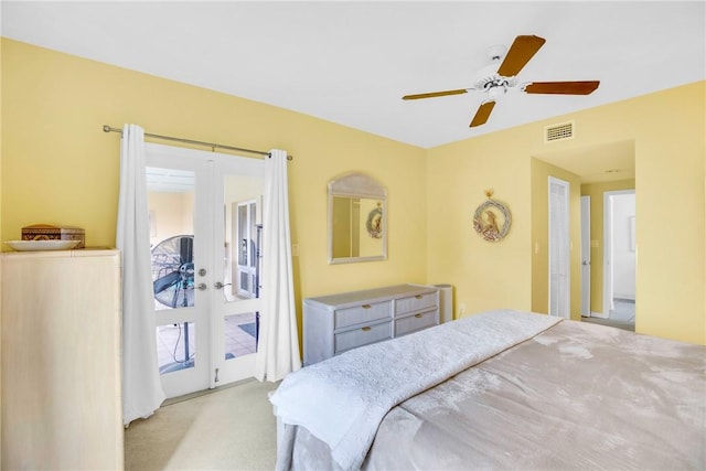 bedroom with light carpet, access to outside, french doors, and ceiling fan