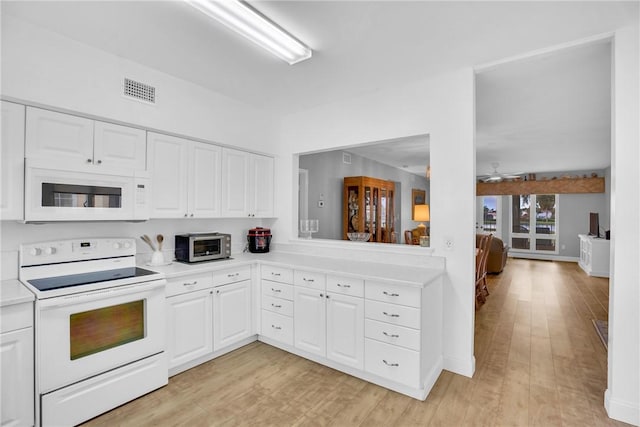 kitchen with white cabinetry, ceiling fan, white appliances, and light hardwood / wood-style flooring