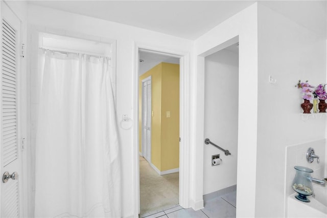 bathroom featuring tile patterned flooring