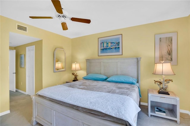 bedroom featuring light carpet and ceiling fan