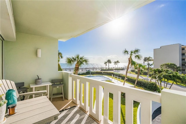 balcony featuring a water view