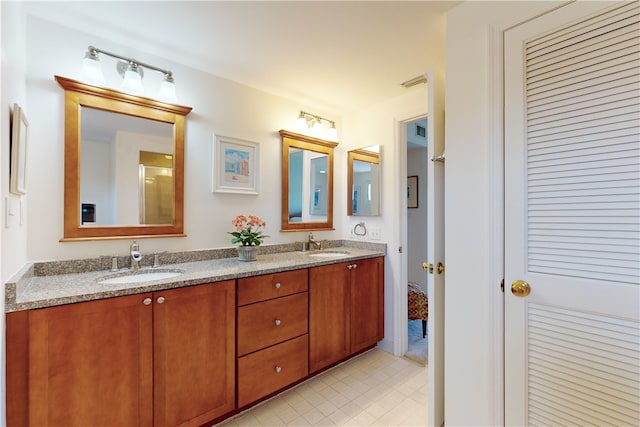 bathroom with vanity and tile patterned floors