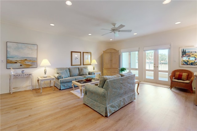 living room featuring crown molding, french doors, ceiling fan, and light hardwood / wood-style flooring