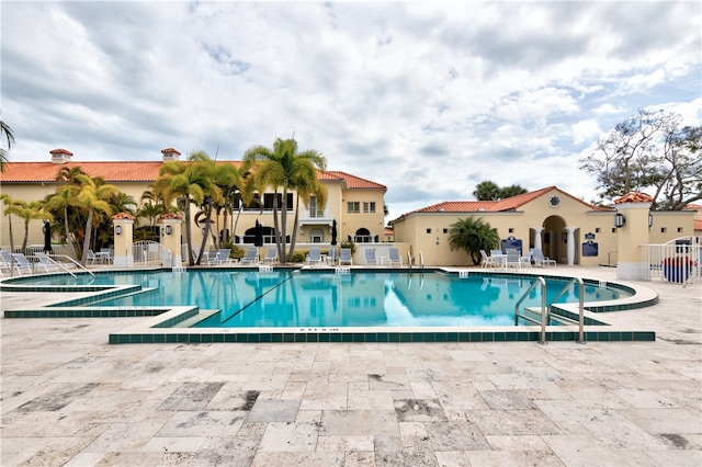 view of swimming pool featuring a patio area