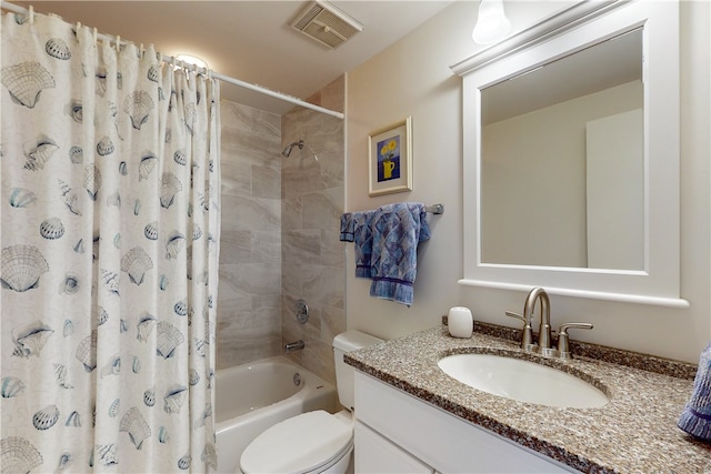 full bathroom with vanity, toilet, and shower / tub combo