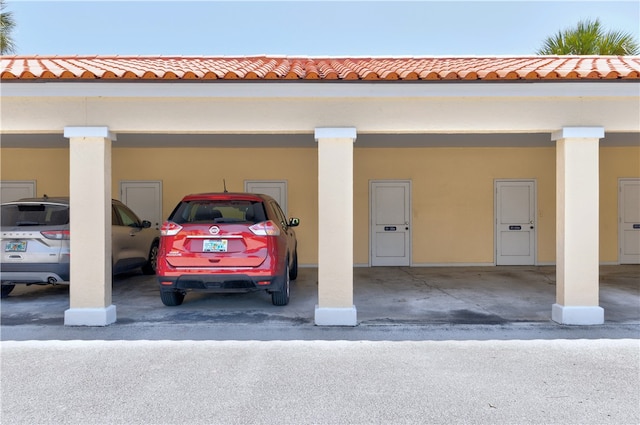 view of parking / parking lot with a carport