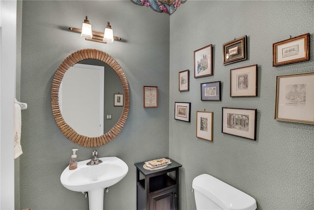 bathroom with a sink and toilet