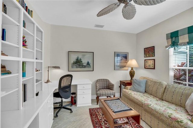 office area featuring baseboards, visible vents, and a ceiling fan