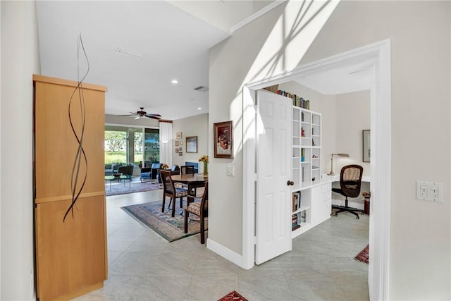 hallway featuring visible vents, baseboards, and recessed lighting